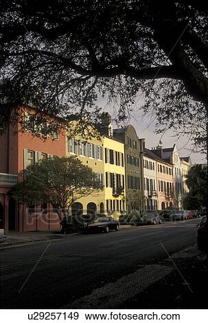 Charleston, South Carolina, SC, Rainbow Row, a collection of colorful historical houses, along East Bay Street in Charleston in the spring. View Large Photo Image Stock Photo - Charleston, South Carolina, SC, Rainbow Row, a collection of colorful historical houses, along East Bay Street in Charleston in the spring.. Fotosearch