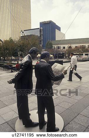 Stock Photography -  Charlotte, NC, North Carolina, Second Hand News Statue in downtown Charlotte.. Fotosearch
