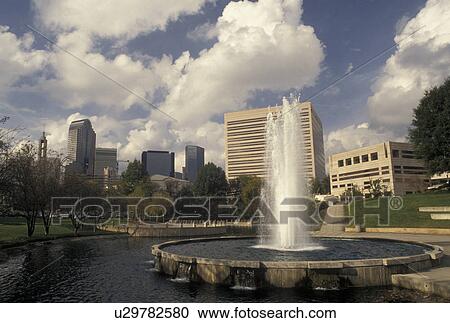 Stock Image -  Charlotte, NC, skyline, North Carolina, Downtown skyline of Charlotte from the fountain at Marshall Park.. Fotosearch