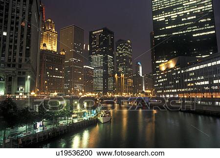 Chicago, IL, skyline, Chicago River, Illinois, Downtown skyline of Chicago is illuminated at night along the Chicago River. View Large Photo Image Stock Image - Chicago, IL, skyline, Chicago River, Illinois, Downtown skyline of Chicago is illuminated at night along the Chicago River.. Fotosearch