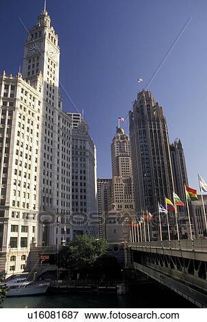 Stock Photo -  Chicago, IL, skyline, Chicago River, Illinois, Michigan Avenue Bridge and downtown skyline of Chicago along the Chicago River.. Fotosearch