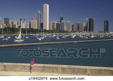 Chicago, IL, skyline, Illinois, Lake Michigan, Scenic view of Chicago Harbor and the downtown skyline from the Lakeshore in Chicago. View Large Photo Image Picture - Chicago, IL, skyline, Illinois, Lake Michigan, Scenic view of Chicago Harbor and the downtown skyline from the Lakeshore in Chicago.. Fotosearch