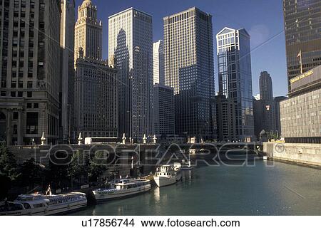 Chicago, IL, skyline, Illinois, Chicago River, A sightseeing tour boats docked along the Chicago River in downtown Chicago. View Large Photo Image Picture - Chicago, IL, skyline, Illinois, Chicago River, A sightseeing tour boats docked along the Chicago River in downtown Chicago.. Fotosearch