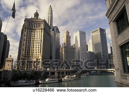 Chicago, IL, skyline, Illinois, Chicago River, A sightseeing tour boats docked along the Chicago River in downtown Chicago. View Large Photo Image Stock Photograph - Chicago, IL, skyline, Illinois, Chicago River, A sightseeing tour boats docked along the Chicago River in downtown Chicago.. Fotosearch