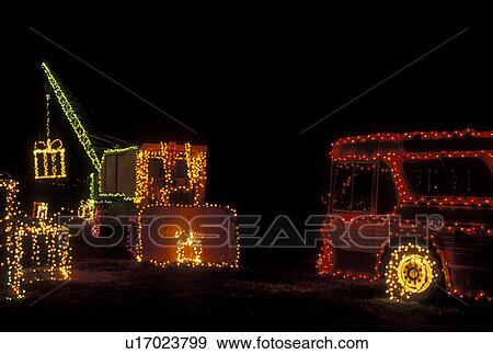 Christmas decorations, Stone Mountain, GA, Georgia, Christmas lights decorate a crane, a bus, and large presents at Georgia's Stone Mountain Park at night View Large Photo Image Stock Photo - Christmas decorations, Stone Mountain, GA, Georgia, Christmas lights decorate a crane, a bus, and large presents at Georgia's Stone Mountain Park at night. Fotosearch
