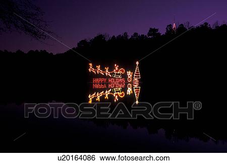 Christmas decorations, Stone Mountain, GA, Georgia, Happy Holidays, Christmas lights of Santa and his sleigh reflect in Stone Mountain Lake at night in Georgia's Stone Mountain Park View Large Photo Image Stock Photograph - Christmas decorations, Stone Mountain, GA, Georgia, Happy Holidays, Christmas lights of Santa and his sleigh reflect in Stone Mountain Lake at night in Georgia's Stone Mountain Park. Fotosearch