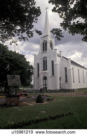 Stock Photo -  church, Acadian, Barachois, New Brunswick, NB, Canada, Historic Church of St. Henri De Barachois the oldest Acadian wooden church in North America in the town of Barachois in New Brunswick.. Fotosearch
