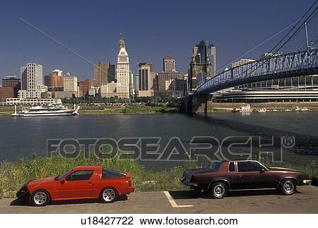 Cincinnati, OH, skyline, Ohio, Ohio River, Downtown skyline of Cincinnati and John A. Roebling Suspension Bridge crossing the Ohio River. View Large Photo Image Stock Image - Cincinnati, OH, skyline, Ohio, Ohio River, Downtown skyline of Cincinnati and John A. Roebling Suspension Bridge crossing the Ohio River.. Fotosearch