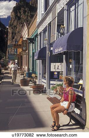 CO, Creede, Colorado, Woman sitting on a bench in the Silver Mining Town of Creede. View Large Photo Image Stock Image - CO, Creede, Colorado, Woman sitting on a bench in the Silver Mining Town of Creede.. Fotosearch