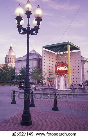 Stock Photo -  coca cola, Atlanta, GA, Underground Atlanta, Georgia, Plaza outside World of Coca-Cola Atlanta in the evening in downtown Atlanta. . Fotosearch