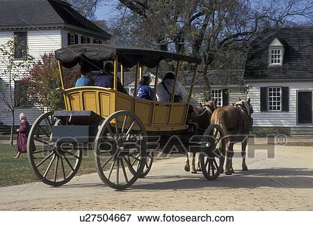 Colonial Williamsburg, horse-drawn carriage, Williamsburg, VA, Virginia, A team of horses pulling a covered carriage carries tourists through the 18th century village of Colonial Williamsburg in Colonial Williamsburg Historic Area. View Large Photo Image Stock Photo - Colonial Williamsburg, horse-drawn carriage, Williamsburg, VA, Virginia, A team of horses pulling a covered carriage carries tourists through the 18th century village of Colonial Williamsburg in Colonial Williamsburg Historic Area.. Fotosearch