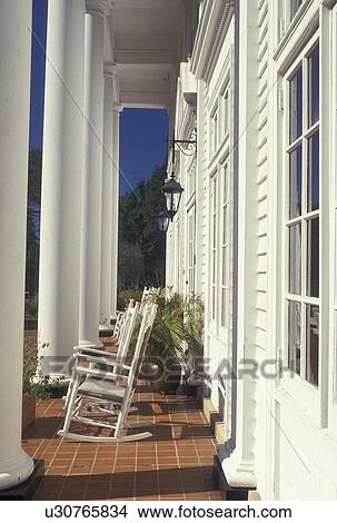 Picture -  country inn, Aiken, SC, South Carolina, Columns and rocking chairs on the front porch of The Wilcox Inn in Aiken.. Fotosearch