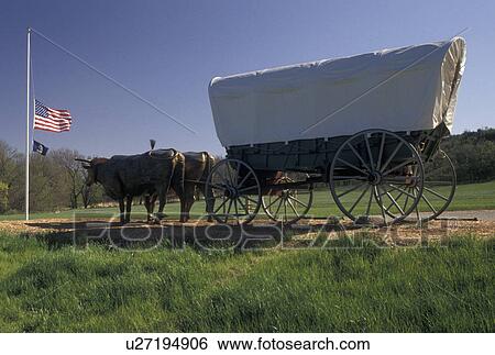 covered wagon, Oregon Trail, KS, Kansas, Statue of covered wagon pulled by a team of oxen along the Oregon Trail in Kansas. View Large Photo Image Stock Photograph - covered wagon, Oregon Trail, KS, Kansas, Statue of covered wagon pulled by a team of oxen along the Oregon Trail in Kansas.. Fotosearch