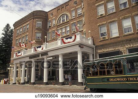 Deadwood, SD, South Dakota, Black Hills, Deadwood trolley outside The Historical Franklin Hotel in downtown Deadwood a National Historic Landmark. View Large Photo Image Picture - Deadwood, SD, South Dakota, Black Hills, Deadwood trolley outside The Historical Franklin Hotel in downtown Deadwood a National Historic Landmark.. Fotosearch