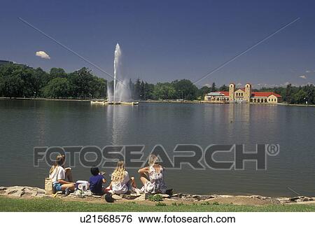 Denver, CO, Colorado, Mother and children feeding ducks on the pond with a water jet at City Park in Denver. View Large Photo Image Stock Photograph - Denver, CO, Colorado, Mother and children feeding ducks on the pond with a water jet at City Park in Denver.. Fotosearch