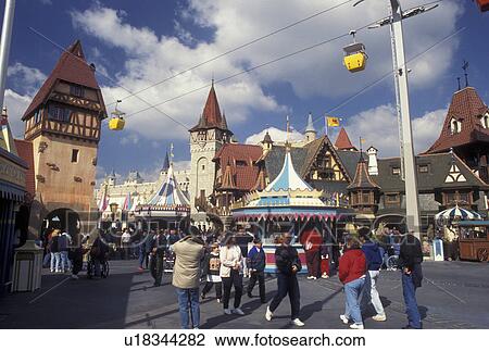 Disney World, Fantasyland, Orlando, Florida, FL, Magic Kingdom, Lake Buena Vista, Crowd of people walk along the street in Fantasyland with the scenic skyway above in the Magic Kingdom at Walt Disney World in Lake Buena Vista. View Large Photo Image Stock Image - Disney World, Fantasyland, Orlando, Florida, FL, Magic Kingdom, Lake Buena Vista, Crowd of people walk along the street in Fantasyland with the scenic skyway above in the Magic Kingdom at Walt Disney World in Lake Buena Vista. . Fotosearch