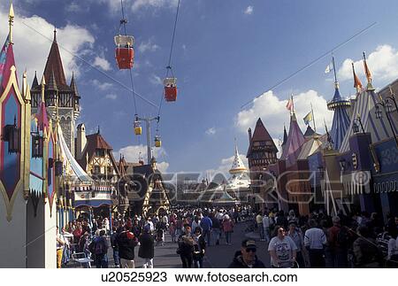 Disney World, Fantasyland, Orlando, FL, Lake Buena Vista, Florida, Crowd of people walk along the street in Fantasyland with the scenic skyway above in the Magic Kingdom at Walt Disney World in Lake Buena Vista. View Large Photo Image Stock Image - Disney World, Fantasyland, Orlando, FL, Lake Buena Vista, Florida, Crowd of people walk along the street in Fantasyland with the scenic skyway above in the Magic Kingdom at Walt Disney World in Lake Buena Vista. . Fotosearch