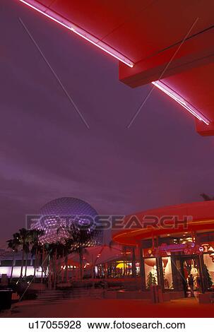 Stock Photo -  Disney World, FL, Orlando, Florida, Lake Buena Vista, Epcot, Gift shops and Spaceship Earth illuminated at night in Epcot Center at Walt Disney World in Lake Buena Vista. . Fotosearch