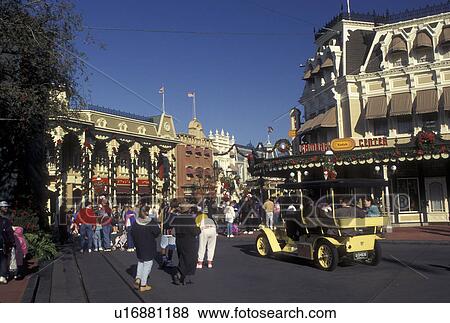 Disney World, FL, Orlando, Lake Buena Vista, Florida, A crowd of people walk down Main Street U. S. A. during the Christmas holiday in the Magic Kingdom at Walt Disney World in Lake Buena Vista. View Large Photo Image Stock Photo - Disney World, FL, Orlando, Lake Buena Vista, Florida, A crowd of people walk down Main Street U. S. A. during the Christmas holiday in the Magic Kingdom at Walt Disney World in Lake Buena Vista.. Fotosearch