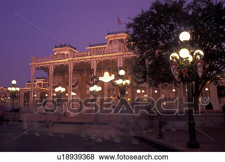Stock Photo -  Disney World, Florida, FL, Orlando, Lake Buena Vista, Magic Kingdom, Disneyana on Main Street U. S. A. in the evening during the Christmas holidays in the Magic Kingdom at Walt Disney World in Lake Buena Vista.. Fotosearch