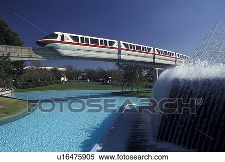 Epcot, monorail, Disney World, Orlando, FL, Lake Buena Vista, Florida, The Monorail passes by a fountain in Epcot Center at Walt Disney World in Lake Buena Vista. View Large Photo Image Stock Photography - Epcot, monorail, Disney World, Orlando, FL, Lake Buena Vista, Florida, The Monorail passes by a fountain in Epcot Center at Walt Disney World in Lake Buena Vista. . Fotosearch