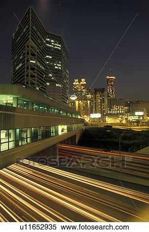 expressway, Atlanta, GA, Georgia, Traffic lights streak under the MARTA on I-75/I-85 in the evening and view of the skyline of downtown Atlanta. View Large Photo Image Stock Photography - expressway, Atlanta, GA, Georgia, Traffic lights streak under the MARTA on I-75/I-85 in the evening and view of the skyline of downtown Atlanta.. Fotosearch