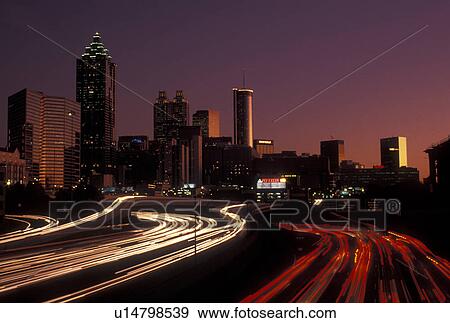 expressway, skyline, Atlanta, GA, Georgia, Skyline of downtown Atlanta and streaks of car lights on I-75 and I-85 connector at sunset. View Large Photo Image Stock Photo - expressway, skyline, Atlanta, GA, Georgia, Skyline of downtown Atlanta and streaks of car lights on I-75 and I-85 connector at sunset.. Fotosearch