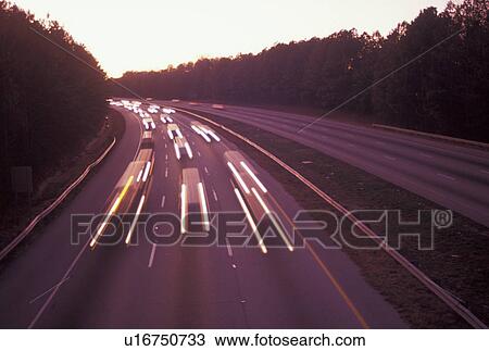 Stock Image -  expressway, traffic, Atlanta, Georgia, GA, Streaks of headlights and taillights of traffic at sunset on Highway 78 in Atlanta. . Fotosearch