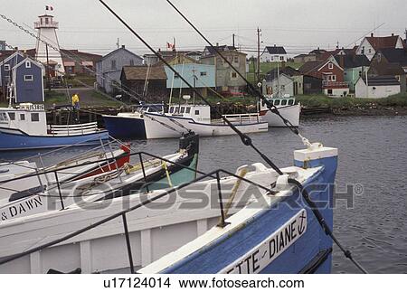 Picture -  fishing boat, Cape Breton, Cabot Trail, Nova Scotia, NS, Canada, Fishing boats moored in the harbor in the fishing village of Cheticamp on Cape Breton Island on in Nova Scotia. . Fotosearch