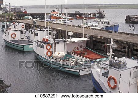 fishing boat, Cape Breton, Cabot Trail, Nova Scotia, NS, Canada, Fishing boats docked in the harbor in the fishing village of Cheticamp on Cape Breton Island on in Nova Scotia. View Large Photo Image Stock Image - fishing boat, Cape Breton, Cabot Trail, Nova Scotia, NS, Canada, Fishing boats docked in the harbor in the fishing village of Cheticamp on Cape Breton Island on in Nova Scotia. . Fotosearch