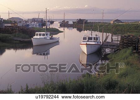Picture -  fishing boat, Nova Scotia, Toney River, NS, Canada, Gulf of St. Lawrence, Lobster fishing boats reflect in the calm water of Toney River in Nova Scotia. . Fotosearch