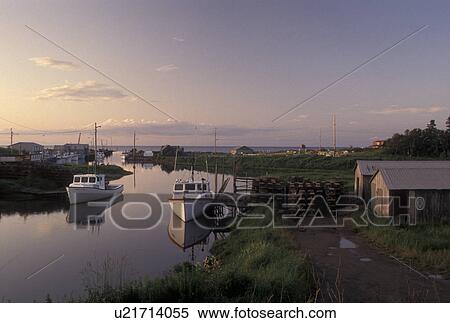 Stock Photography -  fishing boat, Nova Scotia, Toney River, NS, Canada, Gulf of St. Lawrence, Lobster fishing boats reflect in the calm water of Toney River in Nova Scotia. . Fotosearch