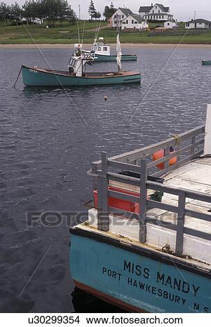Picture -  fishing boats, Cape Breton, Cabot Trail, Nova Scotia, NS, Canada, Atlantic Ocean, Lobster fishing boats buoyed on Ingonish Harbor on Cape Breton Island on in Nova Scotia. . Fotosearch