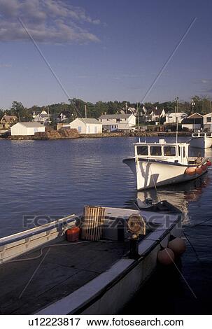 Stock Photo -  fishing boats, Wallace, NS, Nova Scotia, Canada, Gulf of St. Lawrence, Lobster fishing boats docked in the harbor in the fishing village of Wallace on the Northumberland Strait in Nova Scotia. . Fotosearch