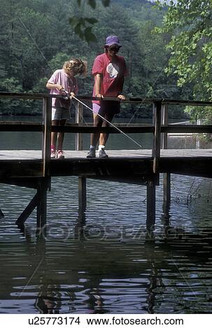 fishing, Chattahoochee National Forest, GA, Georgia, Mother and nine year old daughter fishing off a dock on Lake Tallulah in the Chattahoochee National Forest in North Georgia. View Large Photo Image Picture - fishing, Chattahoochee National Forest, GA, Georgia, Mother and nine year old daughter fishing off a dock on Lake Tallulah in the Chattahoochee National Forest in North Georgia.. Fotosearch