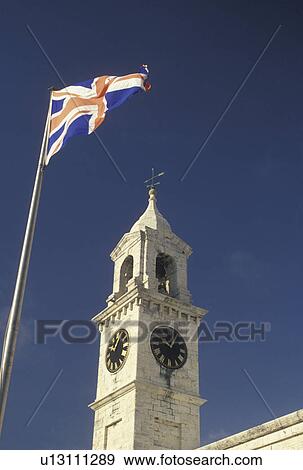 flag, clock tower, Bermuda, The West End, Sandy's Parish, The British Flag fly's outside the Clocktower at the Royal Naval Dockyard at the end of Ireland Island in Sandy's Parish in Bermuda. View Large Photo Image Stock Photo - flag, clock tower, Bermuda, The West End, Sandy's Parish, The British Flag fly's outside the Clocktower at the Royal Naval Dockyard at the end of Ireland Island in Sandy's Parish in Bermuda. . Fotosearch