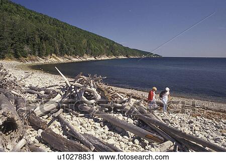 Forillon National Park, Gaspe Peninsula, Quebec, Canada, A senior couple walks along Petit Gaspe Beach in Forillon National Park on the Gaspe Peninsula on the Gulf of St. Lawrence in Quebec. View Large Photo Image Stock Image - Forillon National Park, Gaspe Peninsula, Quebec, Canada, A senior couple walks along Petit Gaspe Beach in Forillon National Park on the Gaspe Peninsula on the Gulf of St. Lawrence in Quebec.. Fotosearch