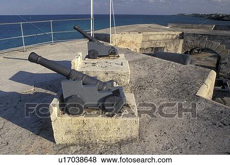 Stock Photo -  fort, Bermuda, St. George's Parish, Cannon on the ramparts of Fort St. Catherine overlooking the Atlantic Ocean in St George in Bermuda.. Fotosearch
