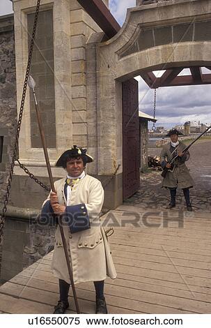 fortress, Cape Breton, Nova Scotia, NS, Canada, Atlantic Ocean, Guards dressed in authentic costumes at Dauphin Gate at the Fortress of Louisbourg National Historic Site on Cape Breton Island in Nova Scotia. View Large Photo Image Stock Photography - fortress, Cape Breton, Nova Scotia, NS, Canada, Atlantic Ocean, Guards dressed in authentic costumes at Dauphin Gate at the Fortress of Louisbourg National Historic Site on Cape Breton Island in Nova Scotia. . Fotosearch