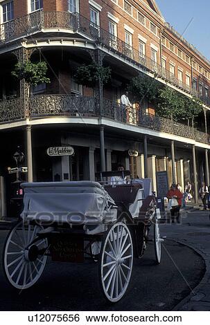 Stock Photograph -  French Quarter, carriage, New Orleans, LA, Louisiana, Carriage ride along the street in the French Quarter in New Orleans. . Fotosearch