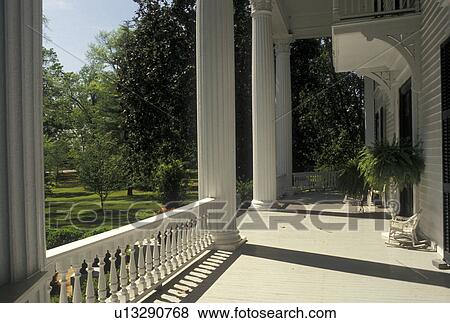Stock Photo -  GA, Washington, Georgia, The front porch of The Chandler/Irving/Ray House in Washington.. Fotosearch