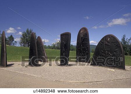 Stock Photo -  Gaspe Peninsula, Gaspe, Jacques Cartier, Quebec, Canada, Jacques Cartier Monument, made up of six bronze plates commemorating his landing, at the Musee de la Gaspesie in Gaspe on the Gaspe Peninsula in Quebec.. Fotosearch