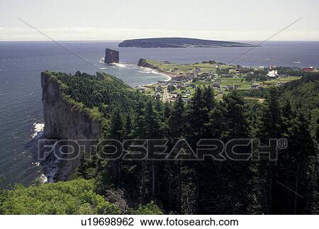 Stock Image -  Gaspe Peninsula, Perce, Quebec, Canada, Gulf of St. Lawrence, Scenic view of the town of Perce on the Gulf of St. Lawrence on Gaspe Peninsula in Quebec.. Fotosearch