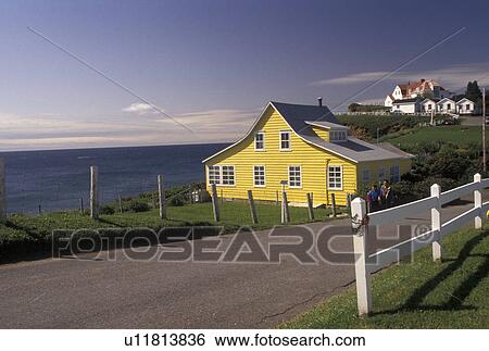 Gaspe Peninsula, Perce, Quebec, Canada, Gulf of St. Lawrence, Yellow house in Perce on the Gulf of St. Lawrence on Gaspe Peninsula in Quebec. View Large Photo Image Stock Photograph - Gaspe Peninsula, Perce, Quebec, Canada, Gulf of St. Lawrence, Yellow house in Perce on the Gulf of St. Lawrence on Gaspe Peninsula in Quebec.. Fotosearch