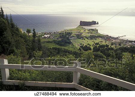 Gaspe Peninsula, Quebec, Perce, Canada, Perce Rock, Gulf of St. Lawrence, Scenic aerial view from overlook of Rocher Perce (Perce Rock) and the town of Perce on the Gulf of St. Lawrence on Gaspe Peninsula in Quebec. View Large Photo Image Picture - Gaspe Peninsula, Quebec, Perce, Canada, Perce Rock, Gulf of St. Lawrence, Scenic aerial view from overlook of Rocher Perce (Perce Rock) and the town of Perce on the Gulf of St. Lawrence on Gaspe Peninsula in Quebec.. Fotosearch