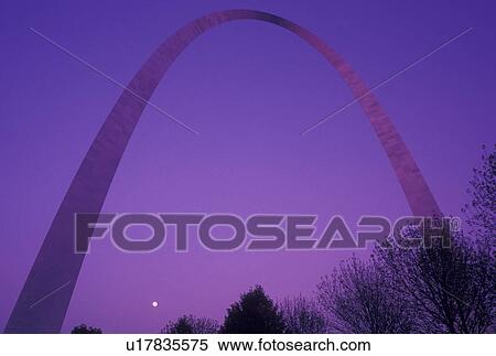 Stock Photography -  Gateway Arch, arch, St. Louis, MO, Missouri, The full moon rises behind The Gateway Arch, Jefferson National Expansion Memorial, in Saint Louis. Gateway to the West.. Fotosearch