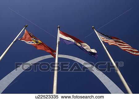 Stock Photography -  Gateway Arch, St. Louis, MO, American Flag, Missouri, Flags fly outside the Gateway Arch, Jefferson National Expansion Memorial, in Saint Louis.. Fotosearch