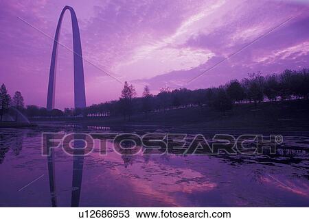 Stock Image -  Gateway Arch, St. Louis, MO, Missouri, The Gateway Arch reflects in the pond at sunrise in Saint Louis. Jefferson National Expansion Memorial. Gateway to the West.. Fotosearch