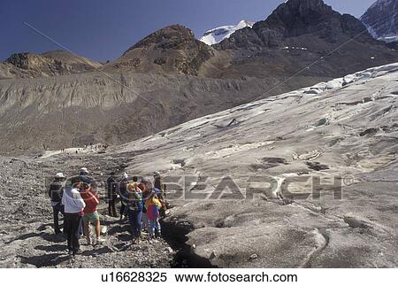 Stock Photography -  glacier, icefield, Jasper National Park, Canada, Alberta, Canadian Rockies, Interpretive talk with a group of people on Athabasca Glacier on Columbia Icefield in Jasper National Park in Alberta.. Fotosearch