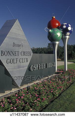 golf club, Disney World, FL, Orlando, Christmas decorations, Lake Buena Vista, Florida, Colorful Christmas balls on large spun-metal golf tees decorate the entrance to the Disney Bonnet Creek Golf Club at Eagle Pines Osprey Ridge in Walt Disney World in View Large Photo Image Stock Photo - golf club, Disney World, FL, Orlando, Christmas decorations, Lake Buena Vista, Florida, Colorful Christmas balls on large spun-metal golf tees decorate the entrance to the Disney Bonnet Creek Golf Club at Eagle Pines Osprey Ridge in Walt Disney World in . Fotosearch